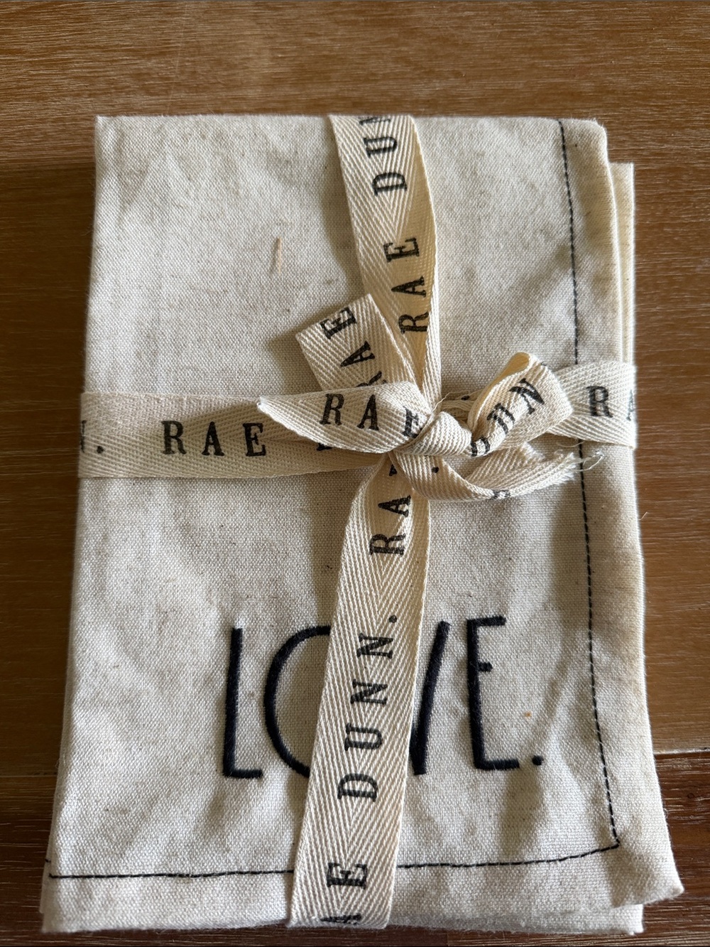 Rae Dunn cream and black 'LOVE' tied tea towel